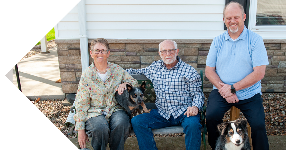 The leadership team of Odorcide, including (l to r) Erin Hart, Mike McGuire, and Andy McGuire with three of their dogs.